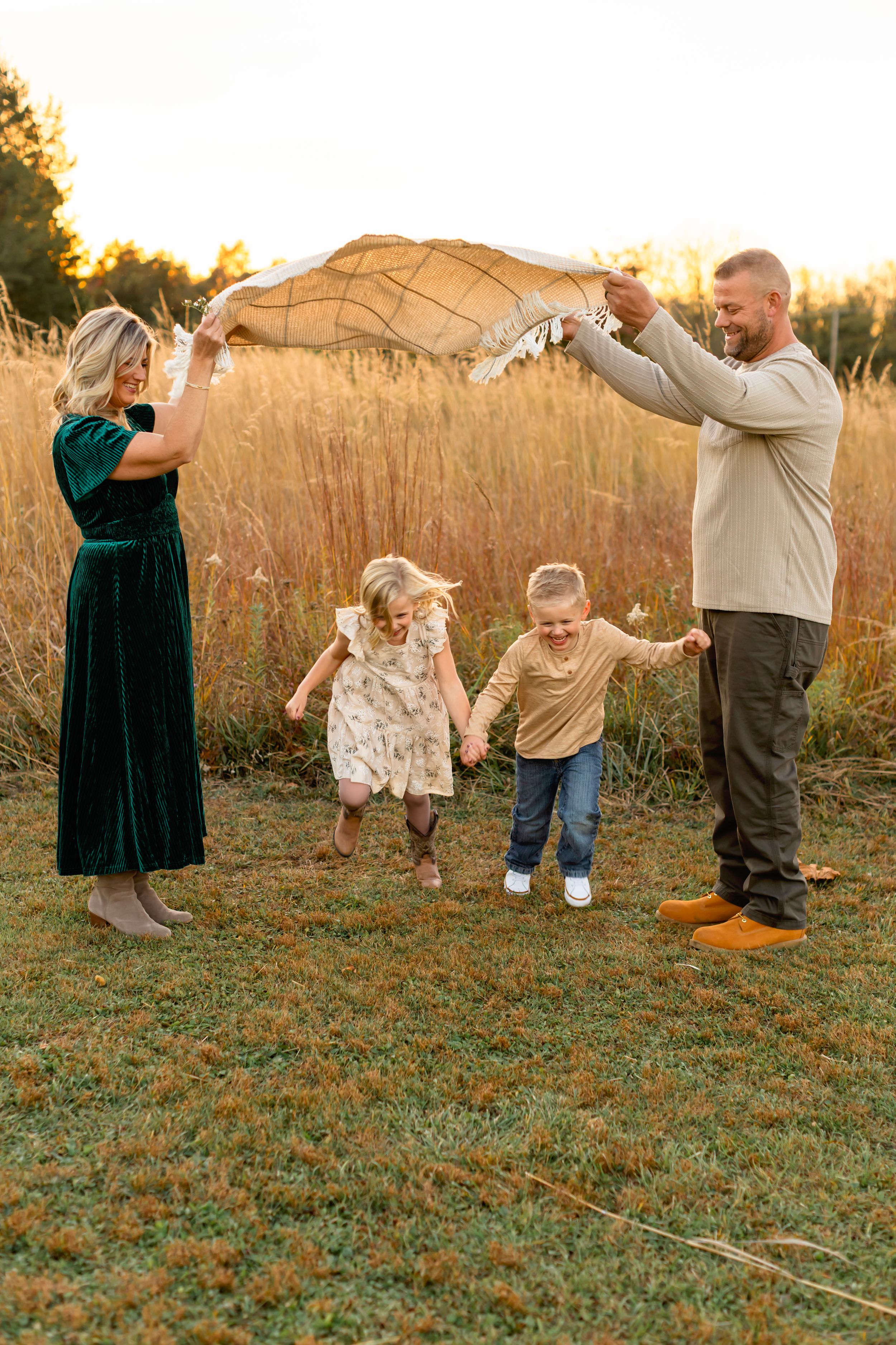 A playful family photo sequence showing dance moves and spins in a grassy field at golden hour.