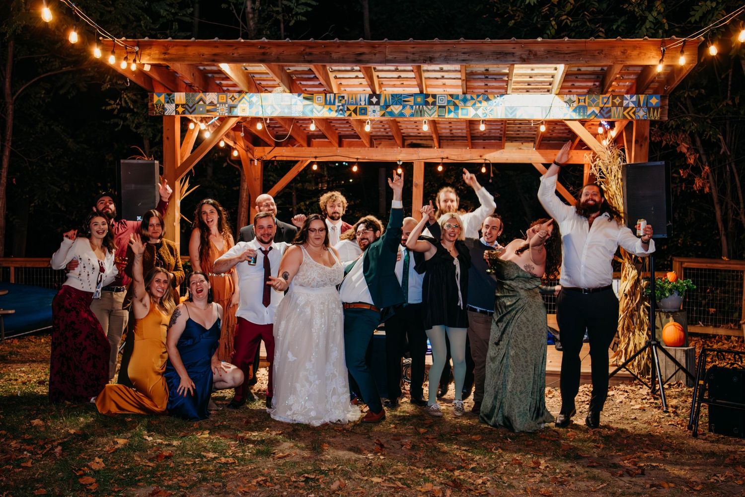 A romantic kiss shared between a bridge and groom in a natural outdoor setting.