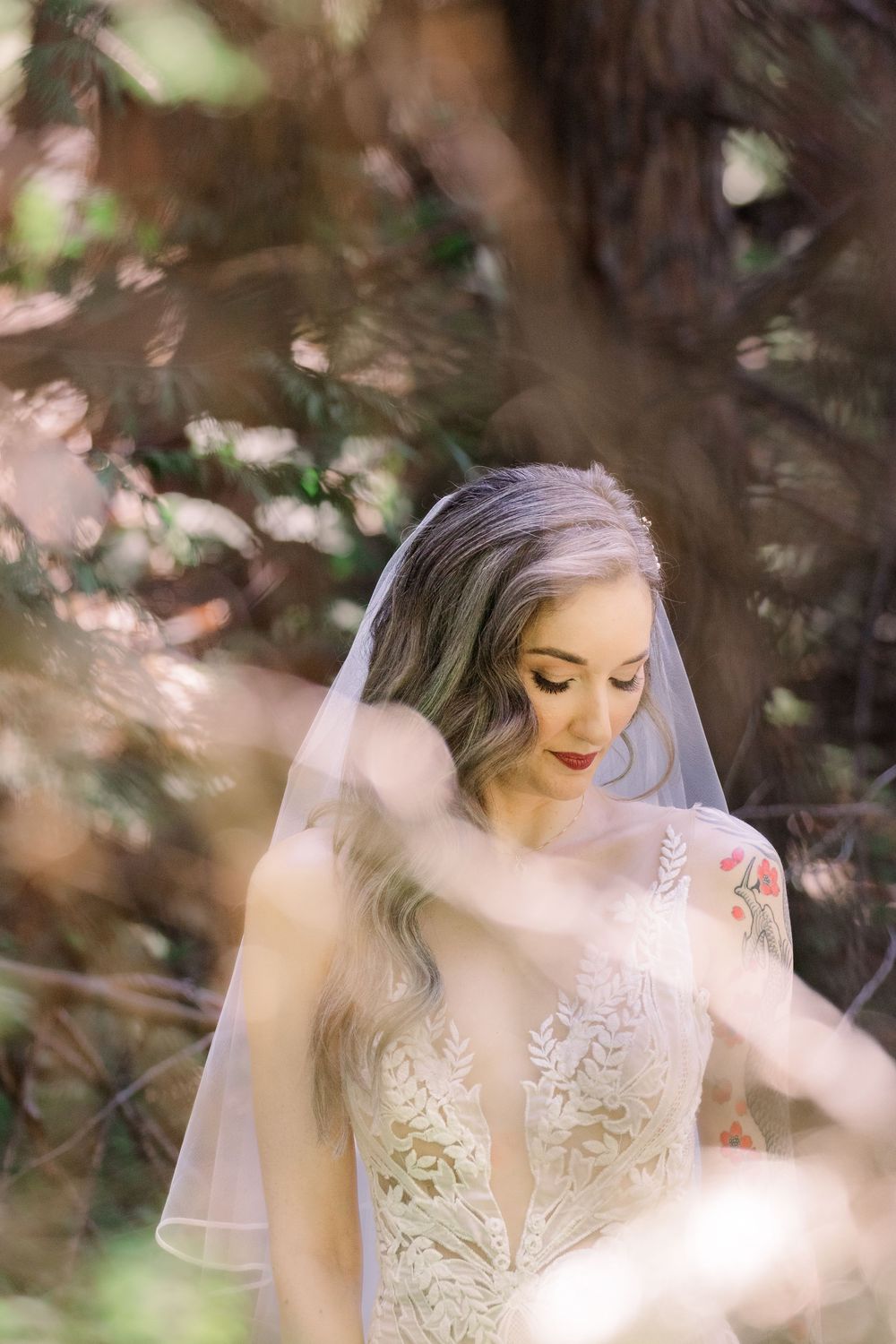 Dreamy bridal portraits with soft lighting filtering through forest trees.
