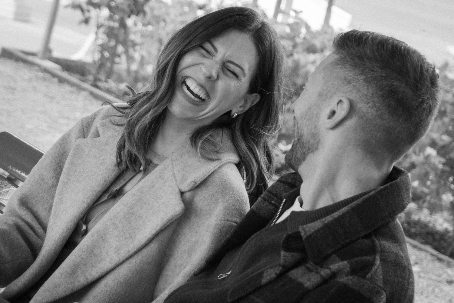 A joyful couple shares intimate moments together in a series of candid photographs.