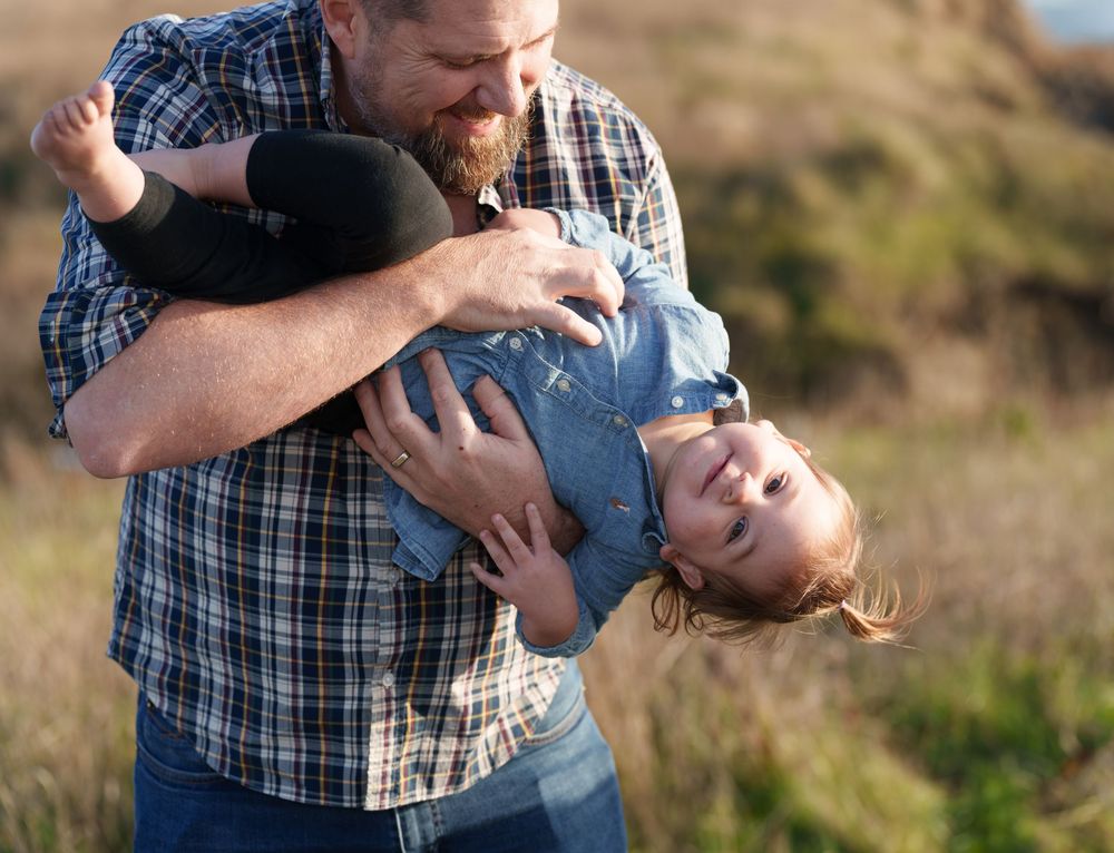 A playful family photo sequence showing joyful moments and laughter at a scenic outdoor location.