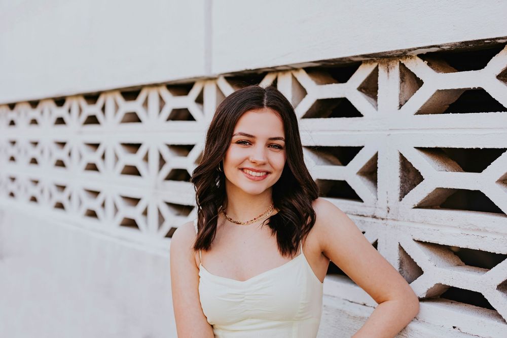 Minimalist portrait session featuring geometric white architecture and natural lighting.