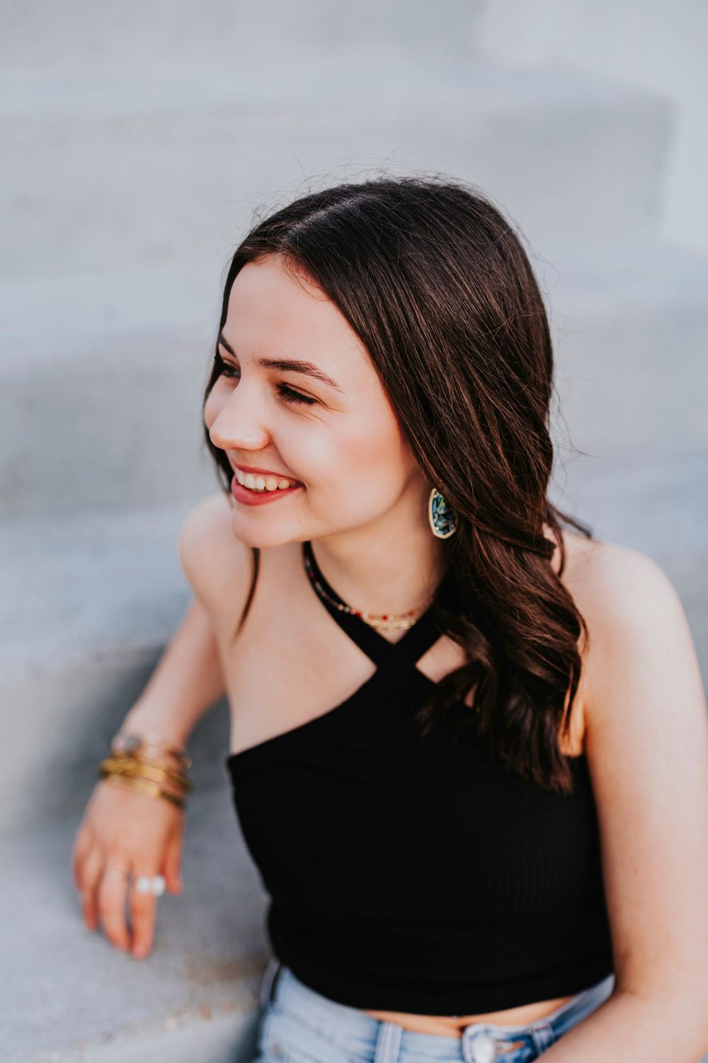 Candid lifestyle portraits showing joyful expressions and casual summer style.
