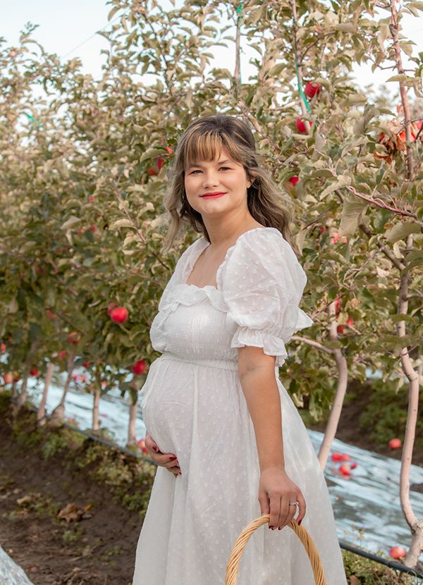 Expecting Mother in White dress during maternity Session in eastern WA