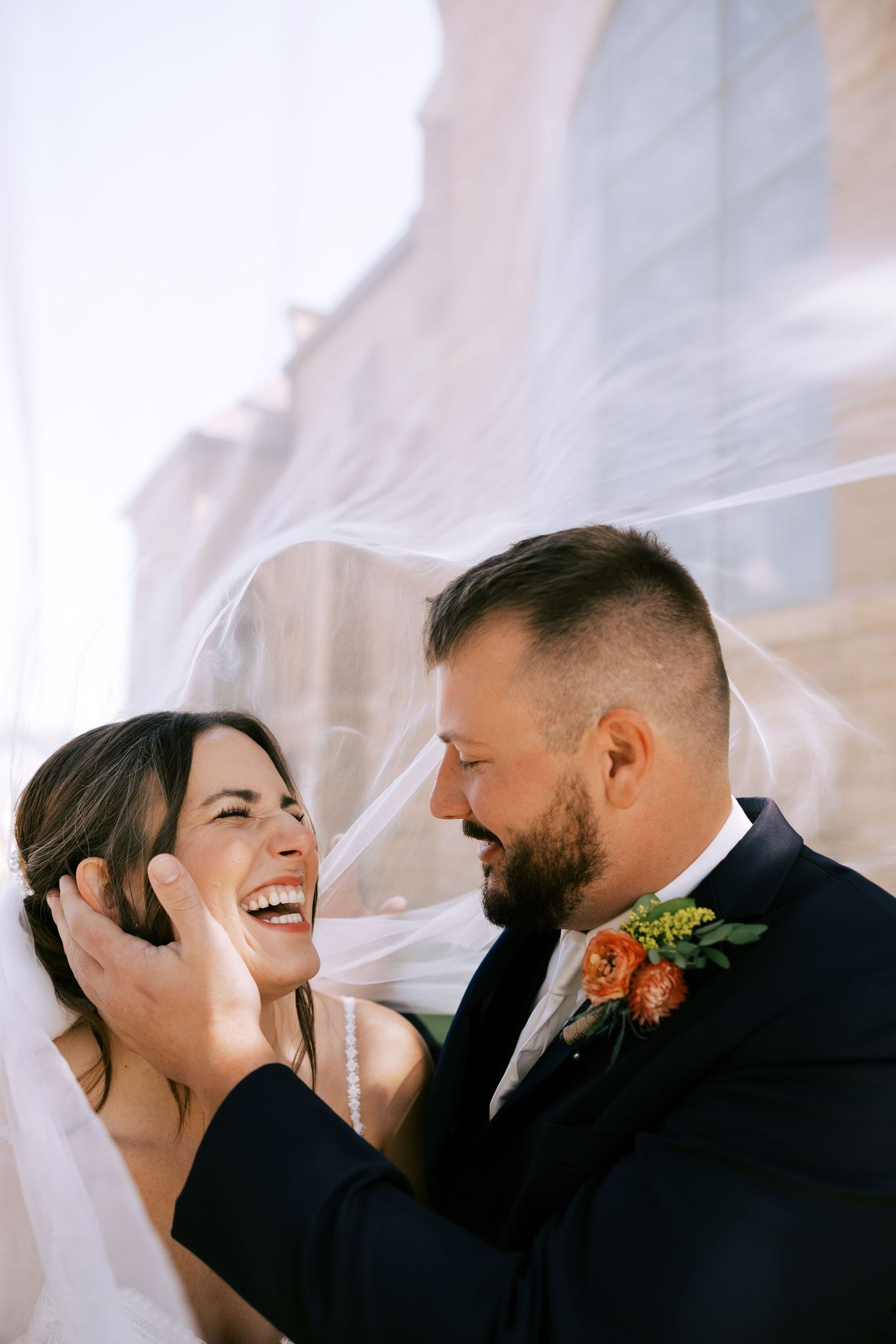 Four sequential photos show a couple in formal wedding attire posing on stone church steps at different angles.