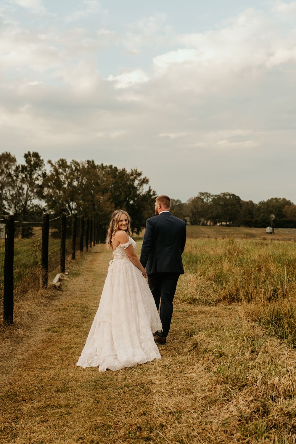 Photograph of bride and groom at Wild Daisy Farm in Molena, Georgia.