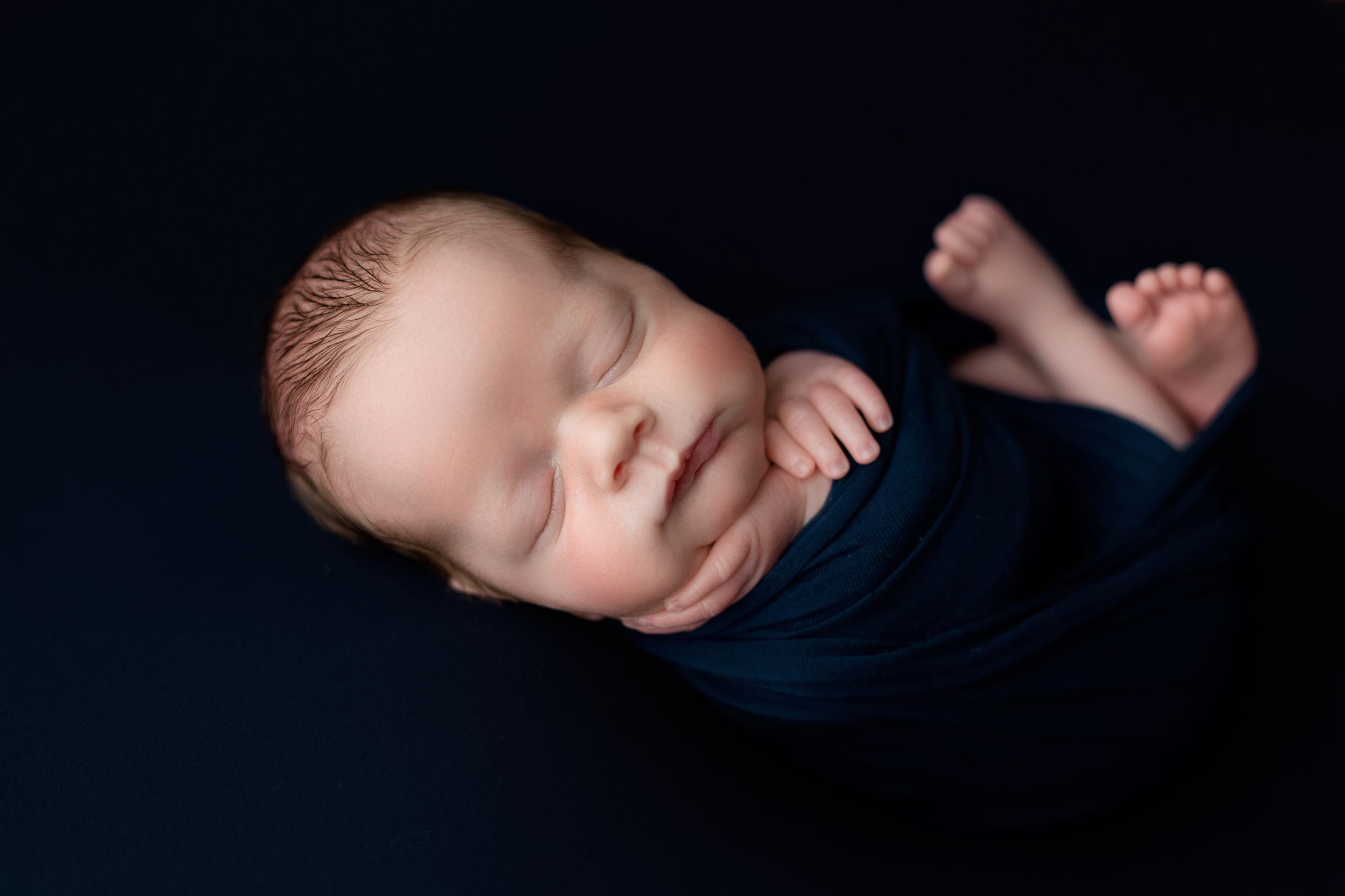 Baby boy with hand on cheek. Greenville SC newborn photographer, Easley SC newborn photographer