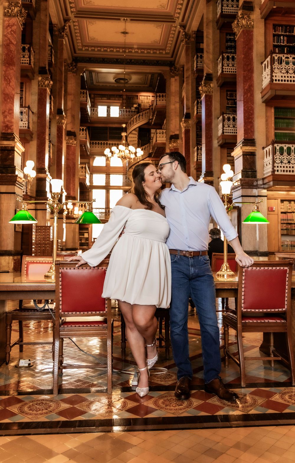 Couple inside the library at the Iowa State Capital during their engagement session.