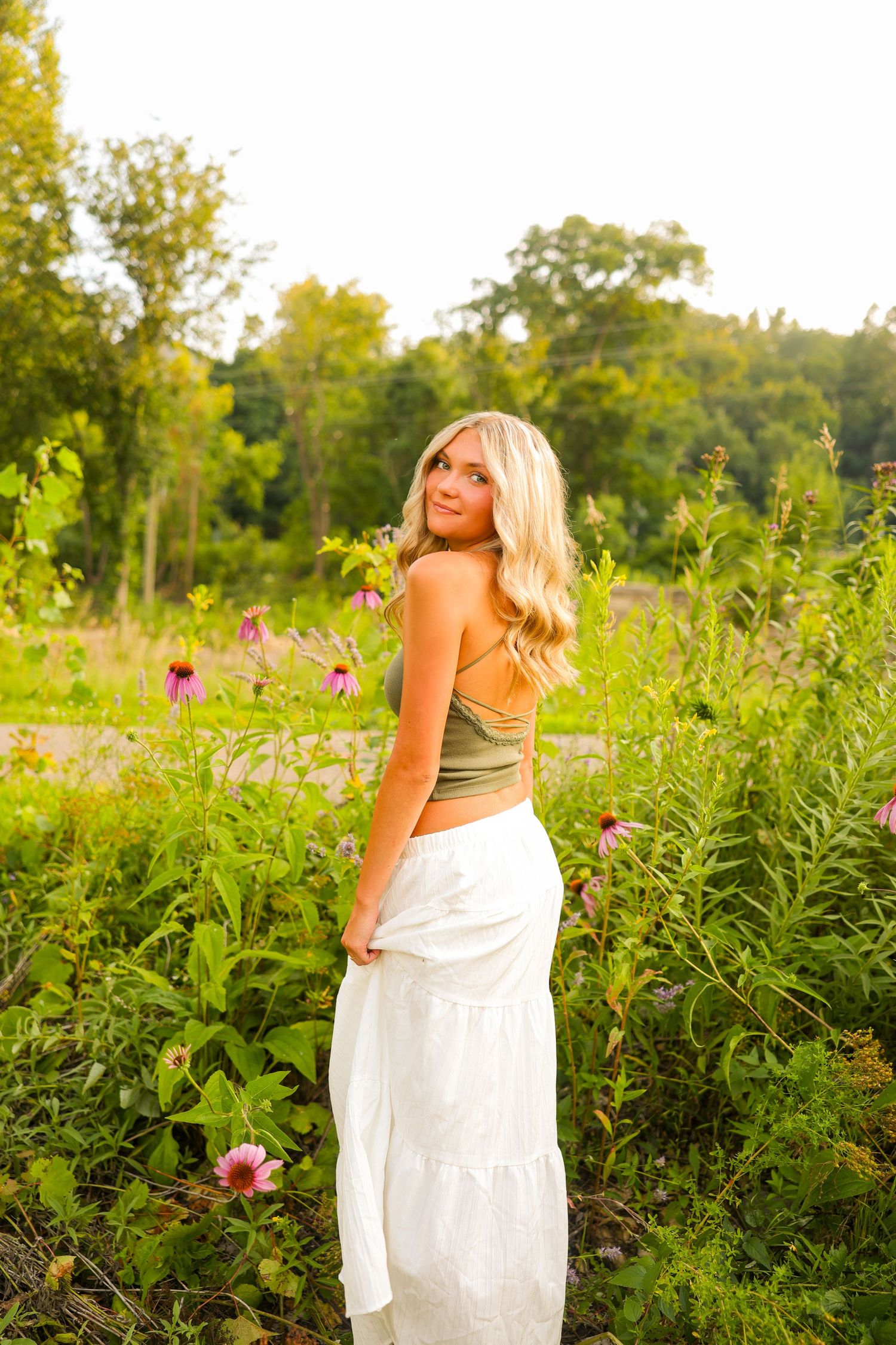Golden hour girl senior photo session in Stillwater MN flower field photographed by josie marie studios.
