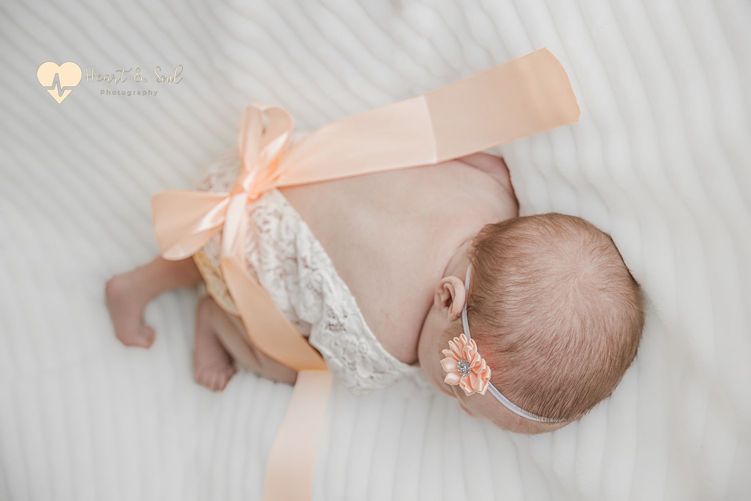 Baby dressed in lace and bows