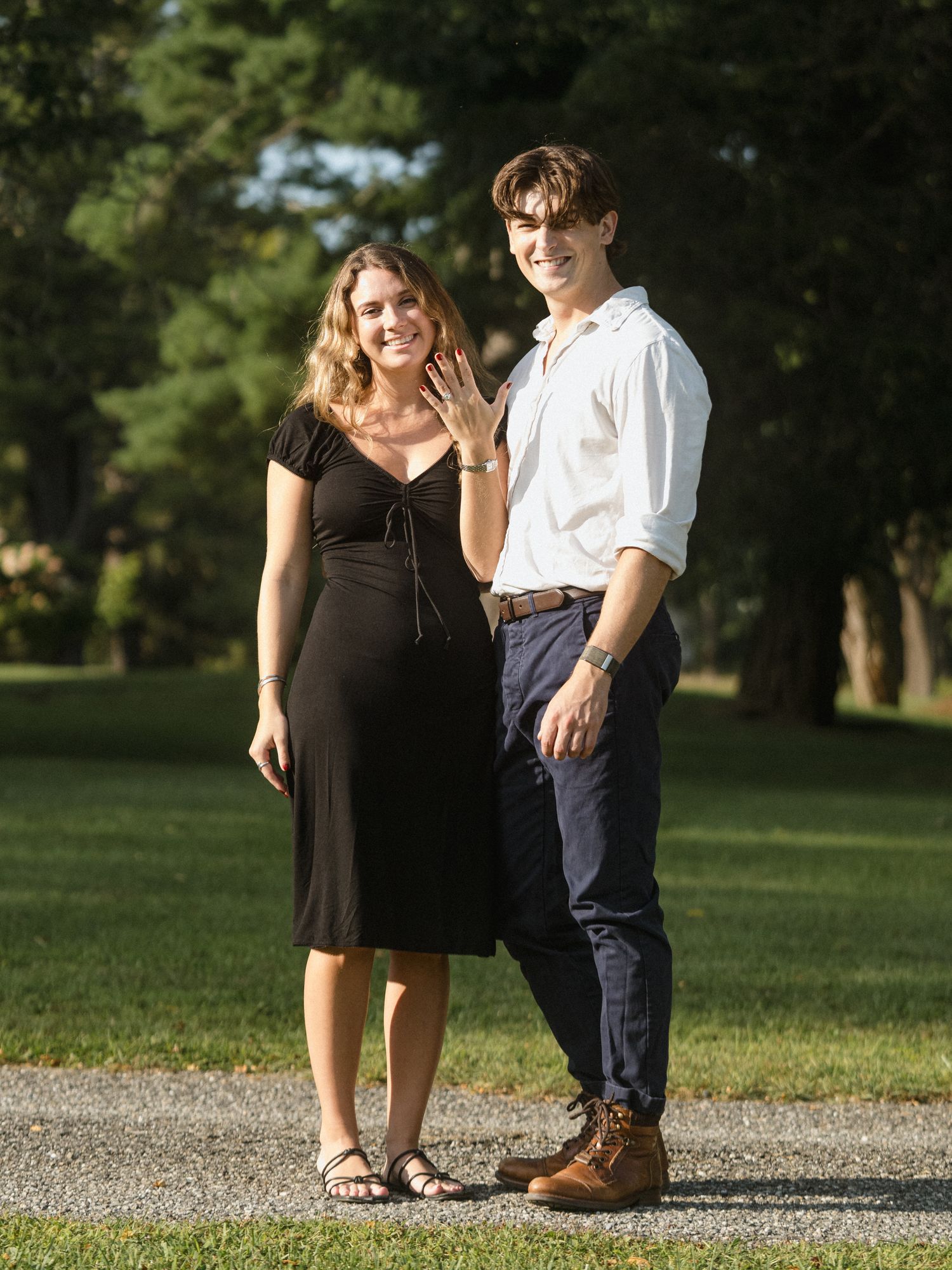 Couple enjoying a casual afternoon together in a peaceful park setting.