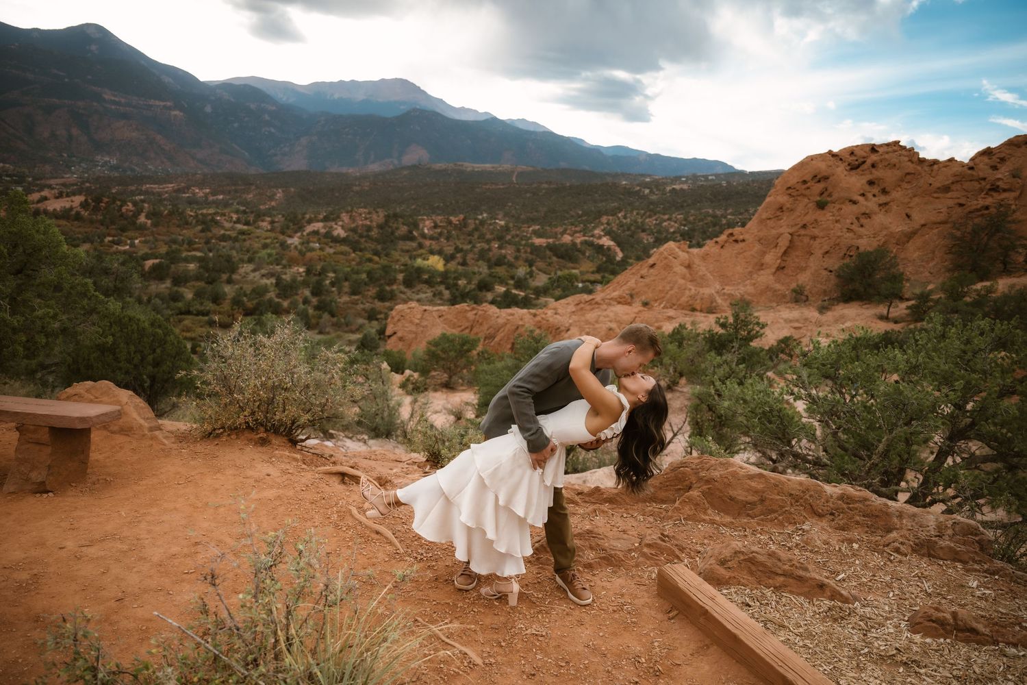 A romantic photo series against dramatic red rock formations in a desert landscape.