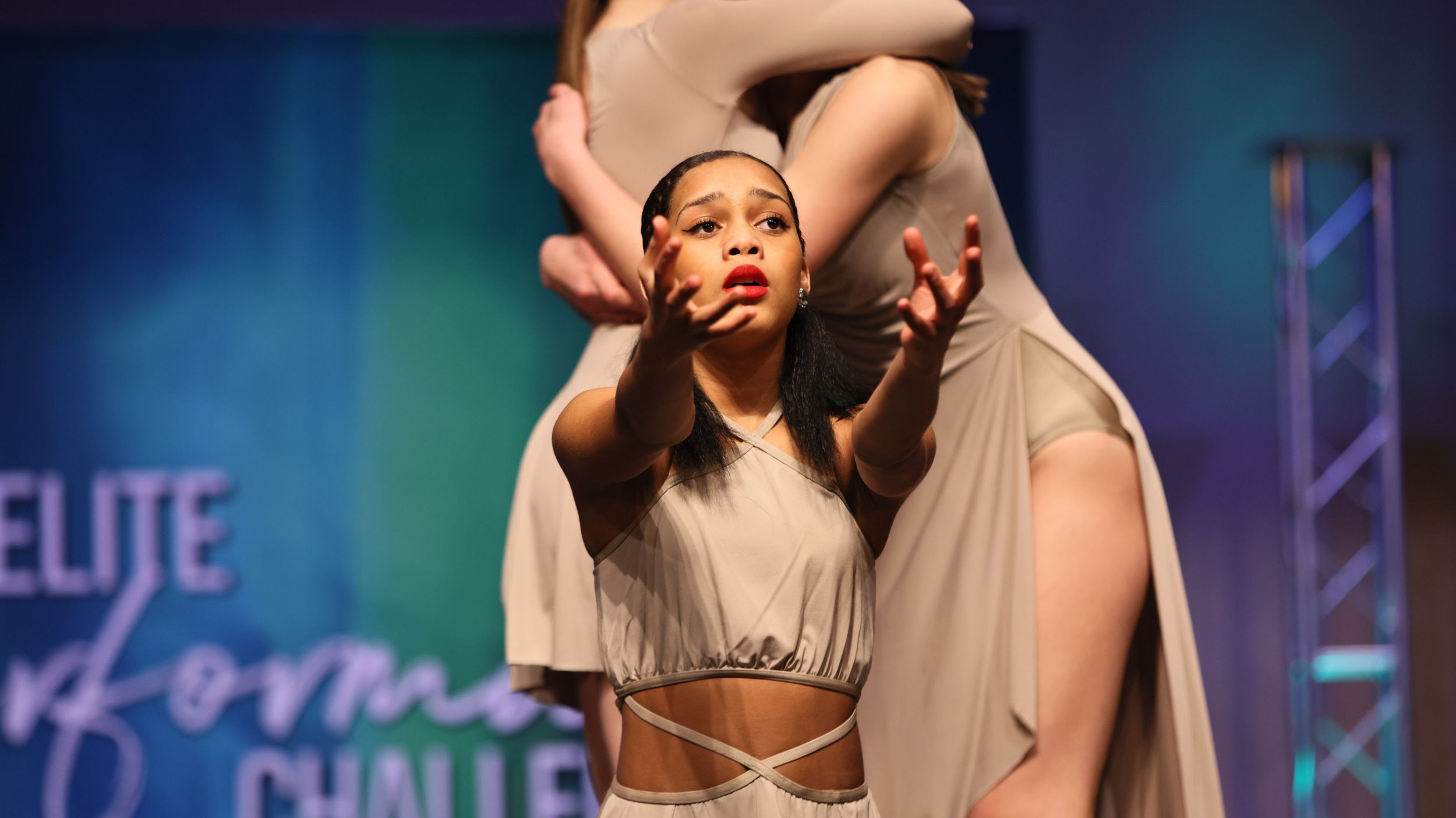 Two female dancers perform contemporary duet in flowing white costumes at Elite Performers Challenge.