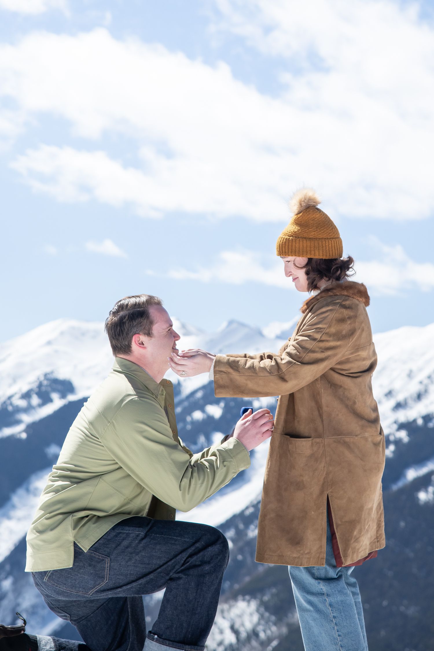 Romantic winter proposal at the top of Aspen mountain