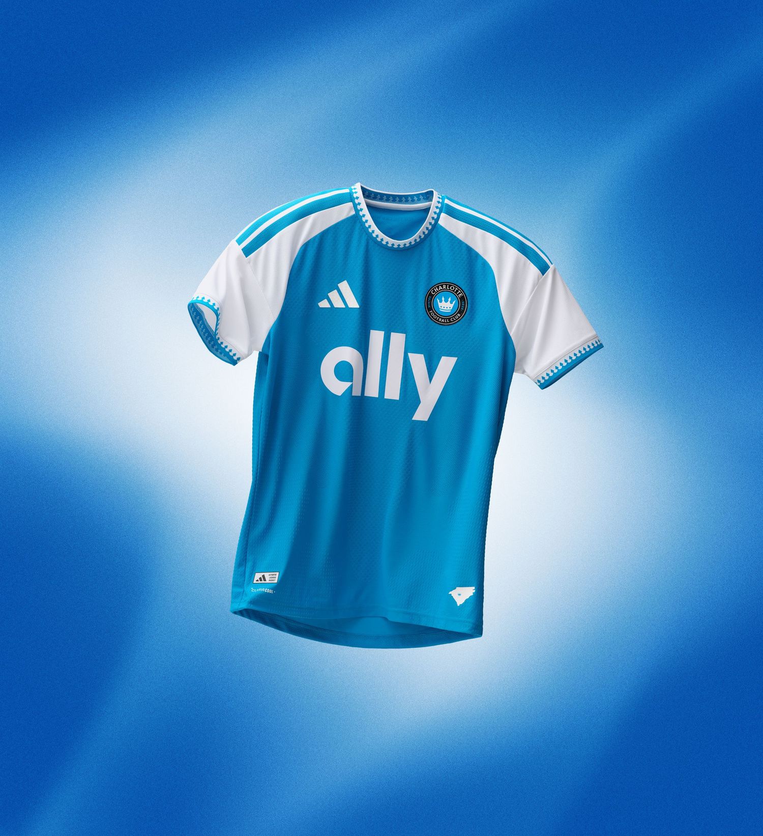 Charlotte FC 2025 Adidas home kit in blue and white with Ally sponsor and crown crest.