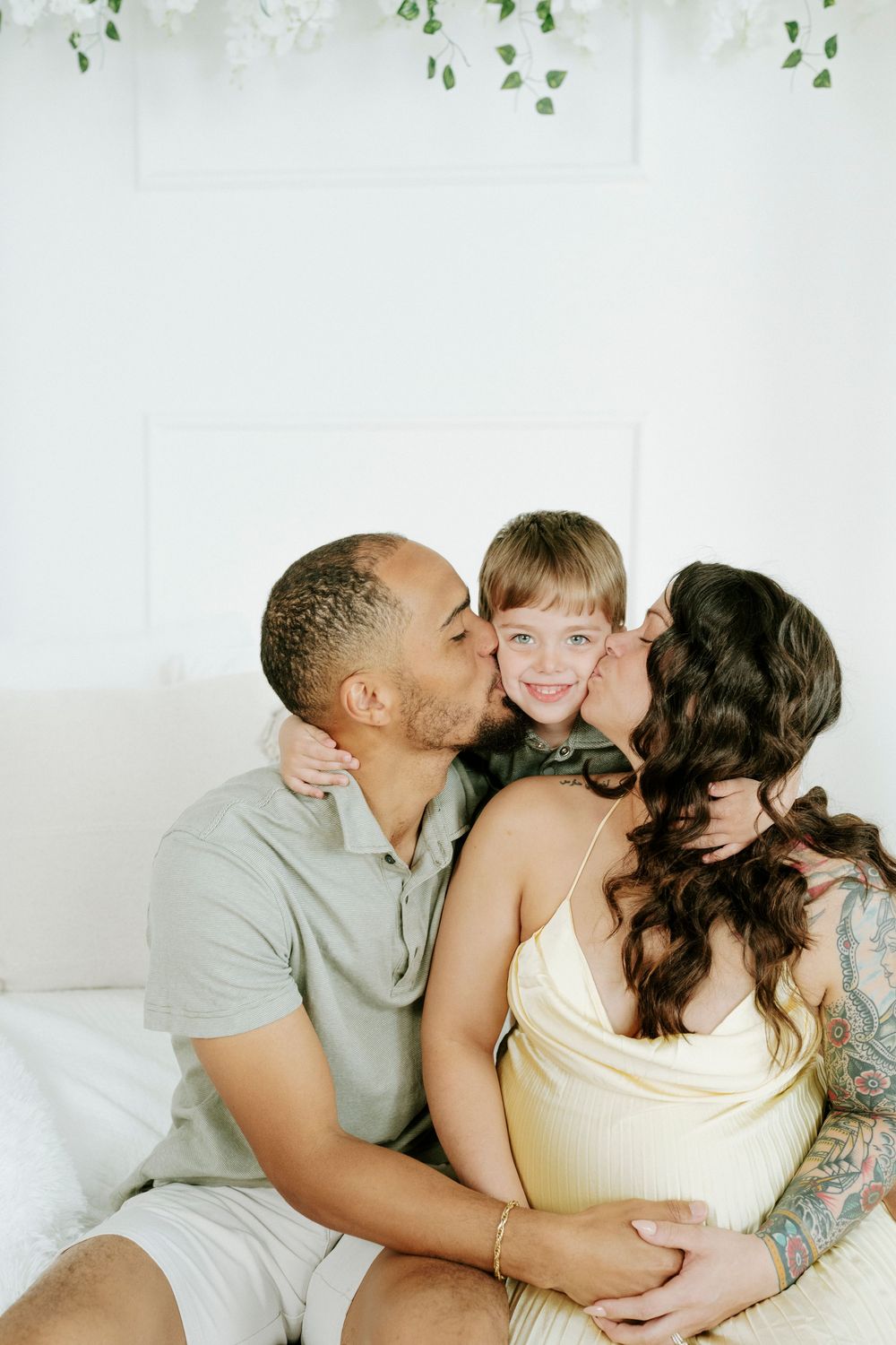 A series of intimate lifestyle photos showing tender moments between a couple sharing kisses and embraces on a light background.