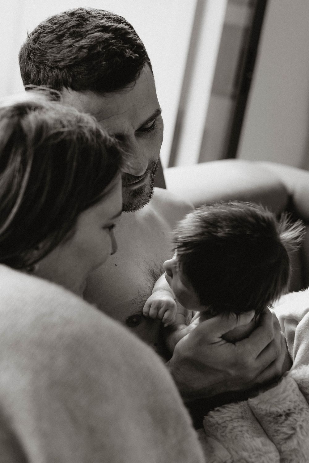 A tender black and white photo sequence showing a couple sharing intimate kisses and embraces.