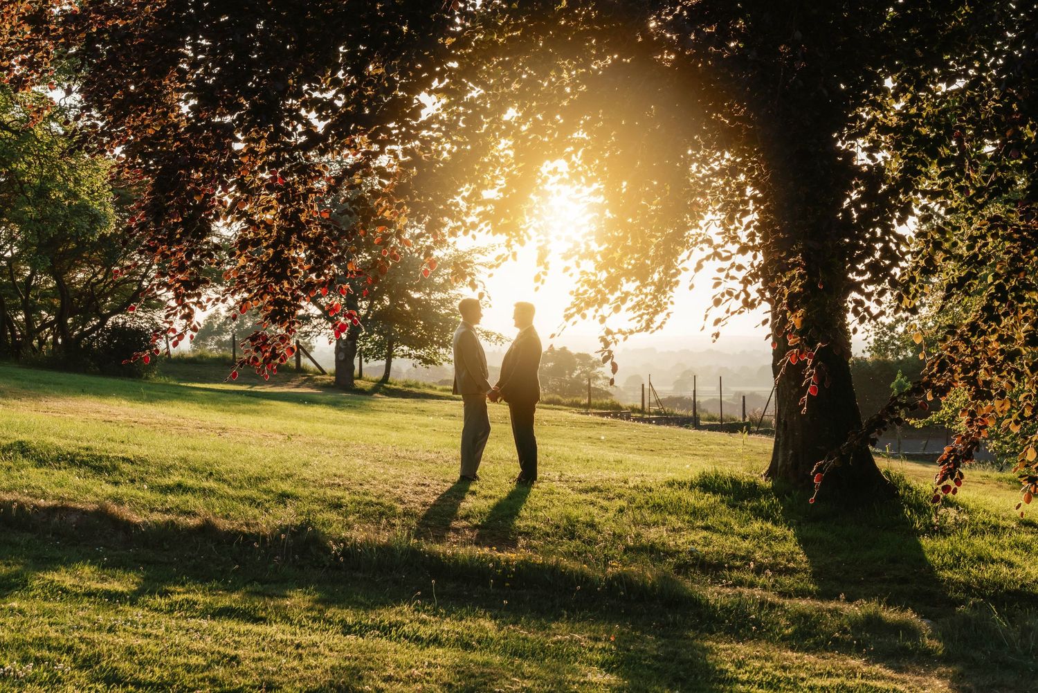 Coombe Lodge Wedding Photographer Zara Davis Photography Somerset Blagdon sunset portrait of grooms LGBTQIA+ silhousette against sunset