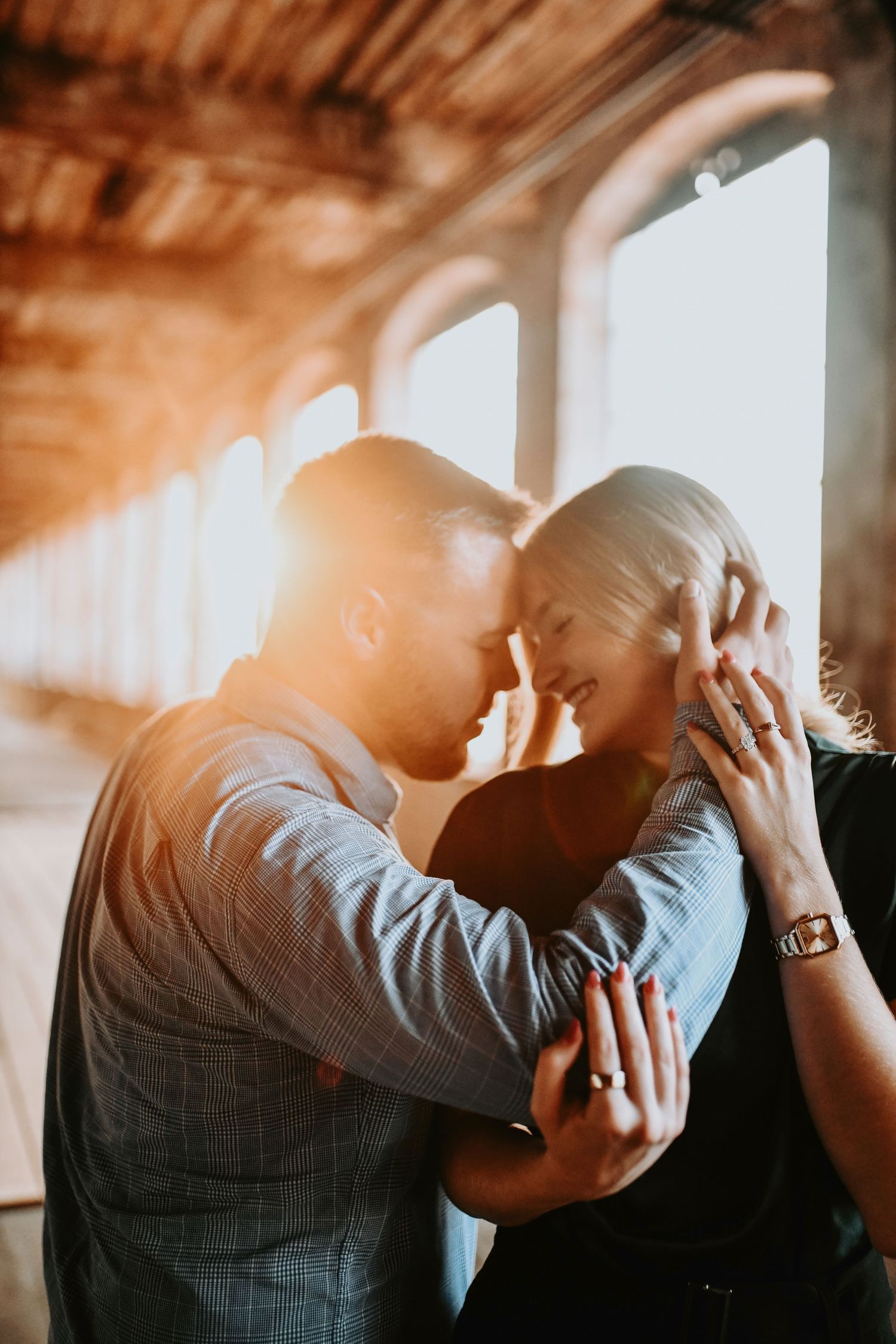 Couple smiling together after saying yes at McKinney Cotton Mill