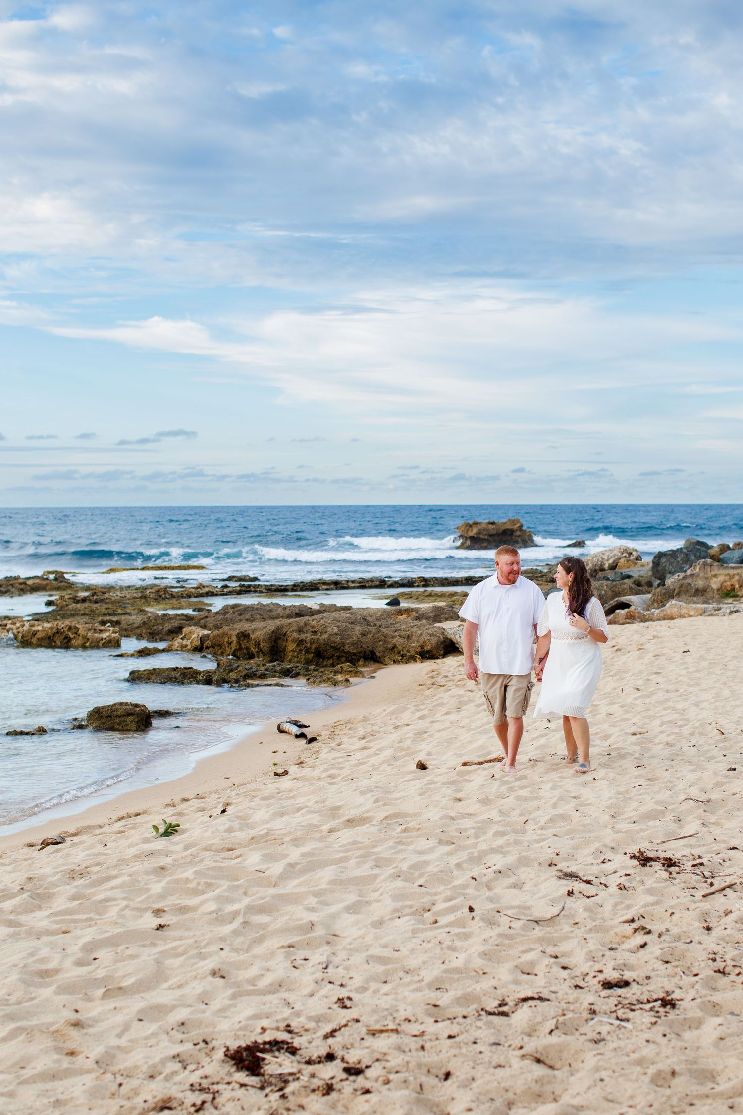 Elopement on the beach at Balneario del Escambrón in Old San Juan, Puerto Rico. Couples portrait - bride and groom.