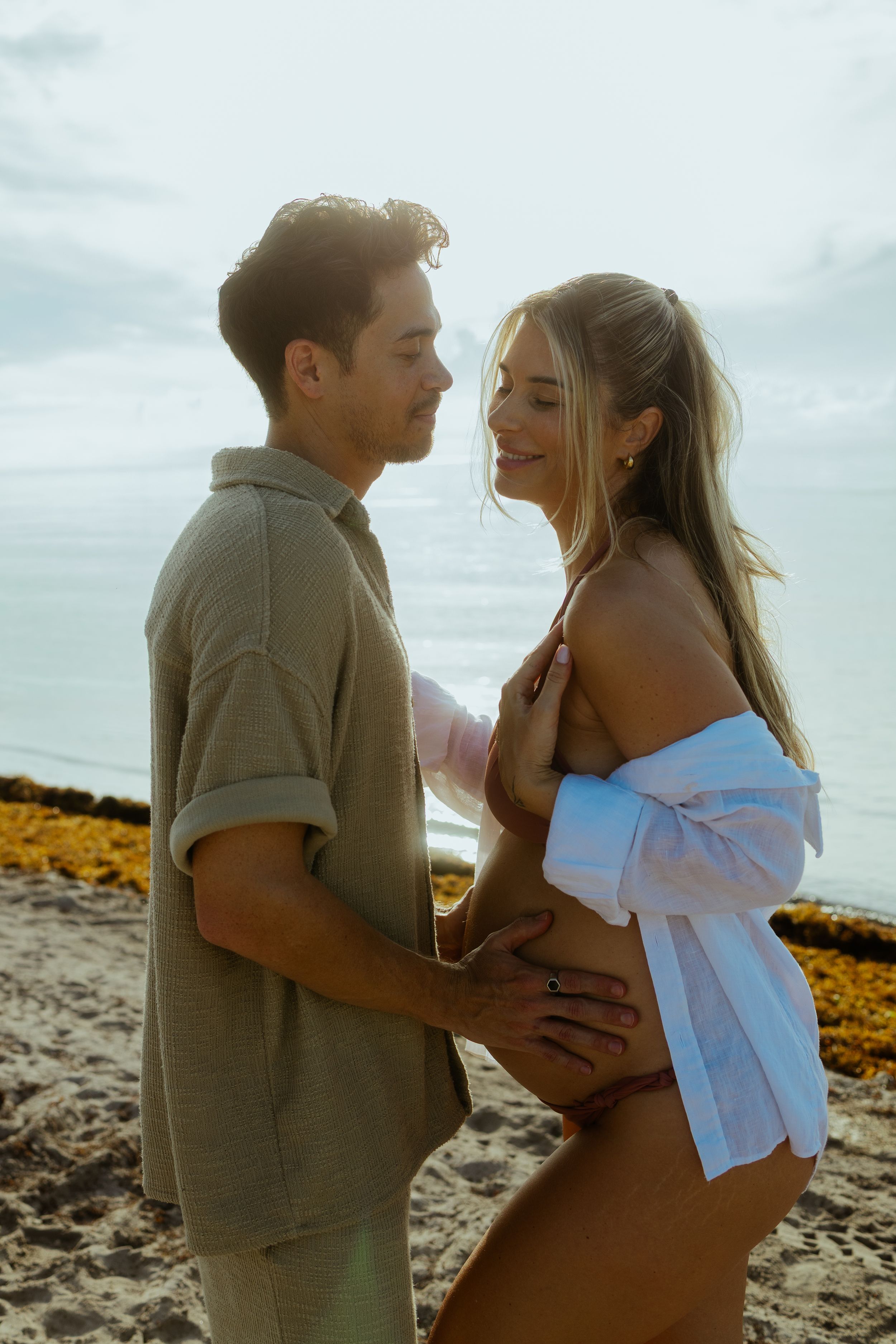 Cinematic Miami beach couple portrait, styled for maternity, engagements, or anniversaries by MannyPortraits.