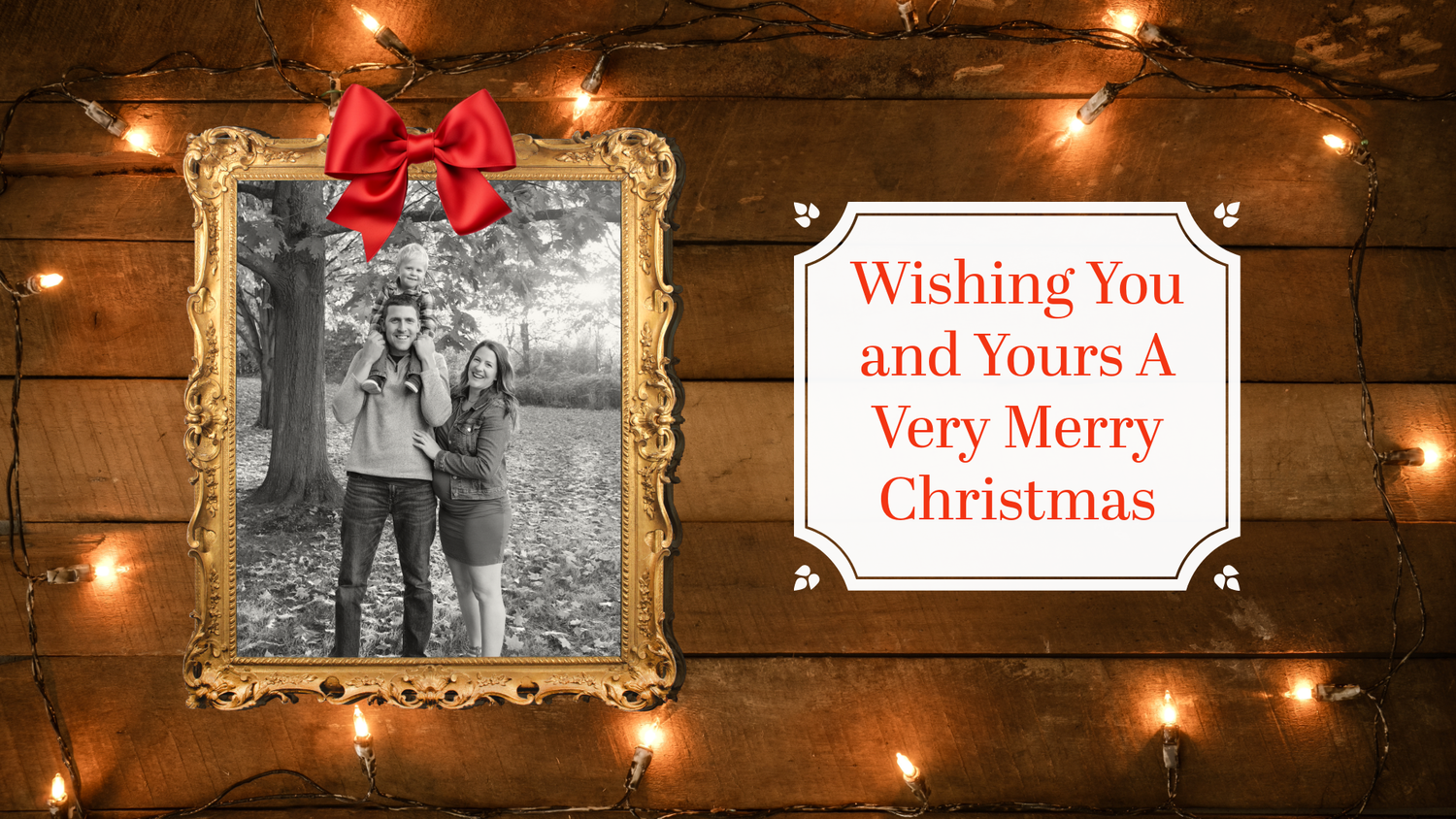 A vintage-style holiday banner with red bows and gold frames decorated with Christmas greenery against a dark background.