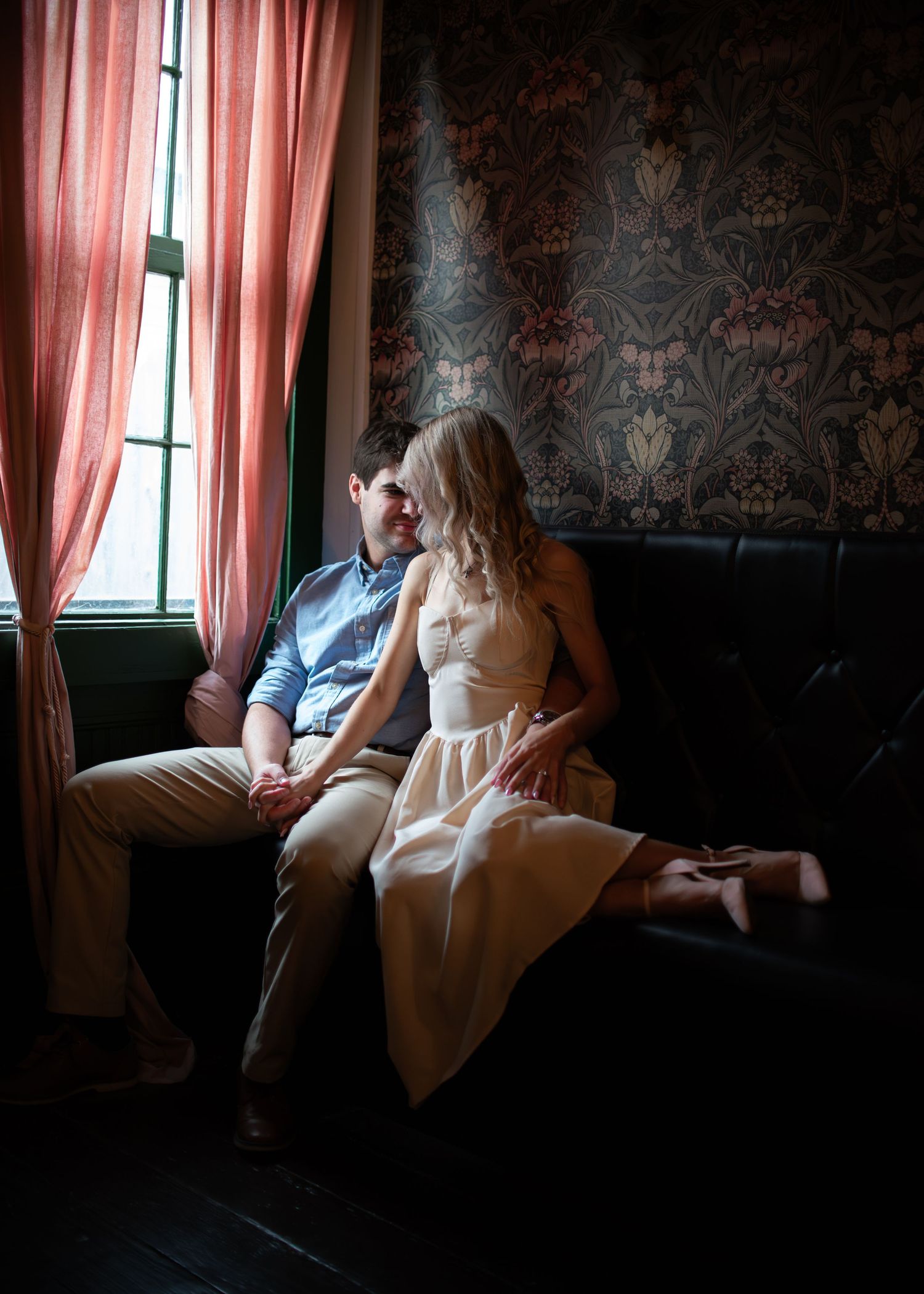 Engaged couple during session at Greenfield’s Coffee and Cocktails in Salado Texas