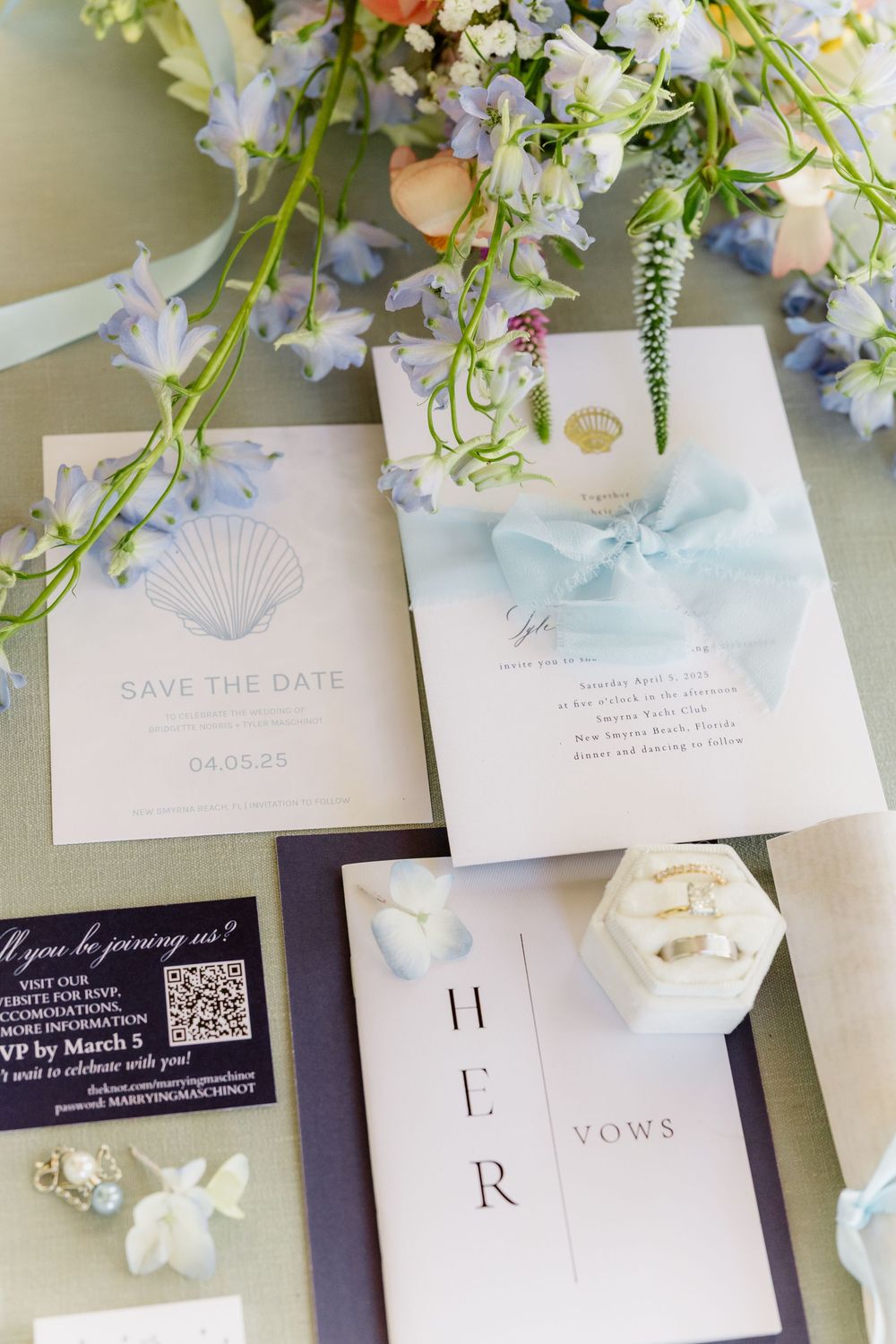 Wedding stationery suite with floral decorations and light blue watercolor designs.