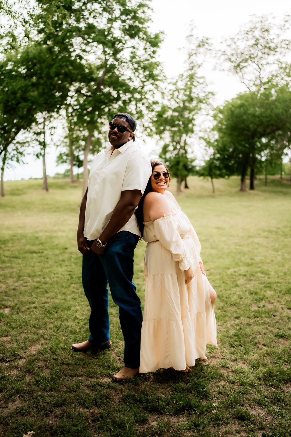 A charming engagement photo sequence shows a playful peek behind bushes in a grassy outdoor setting.