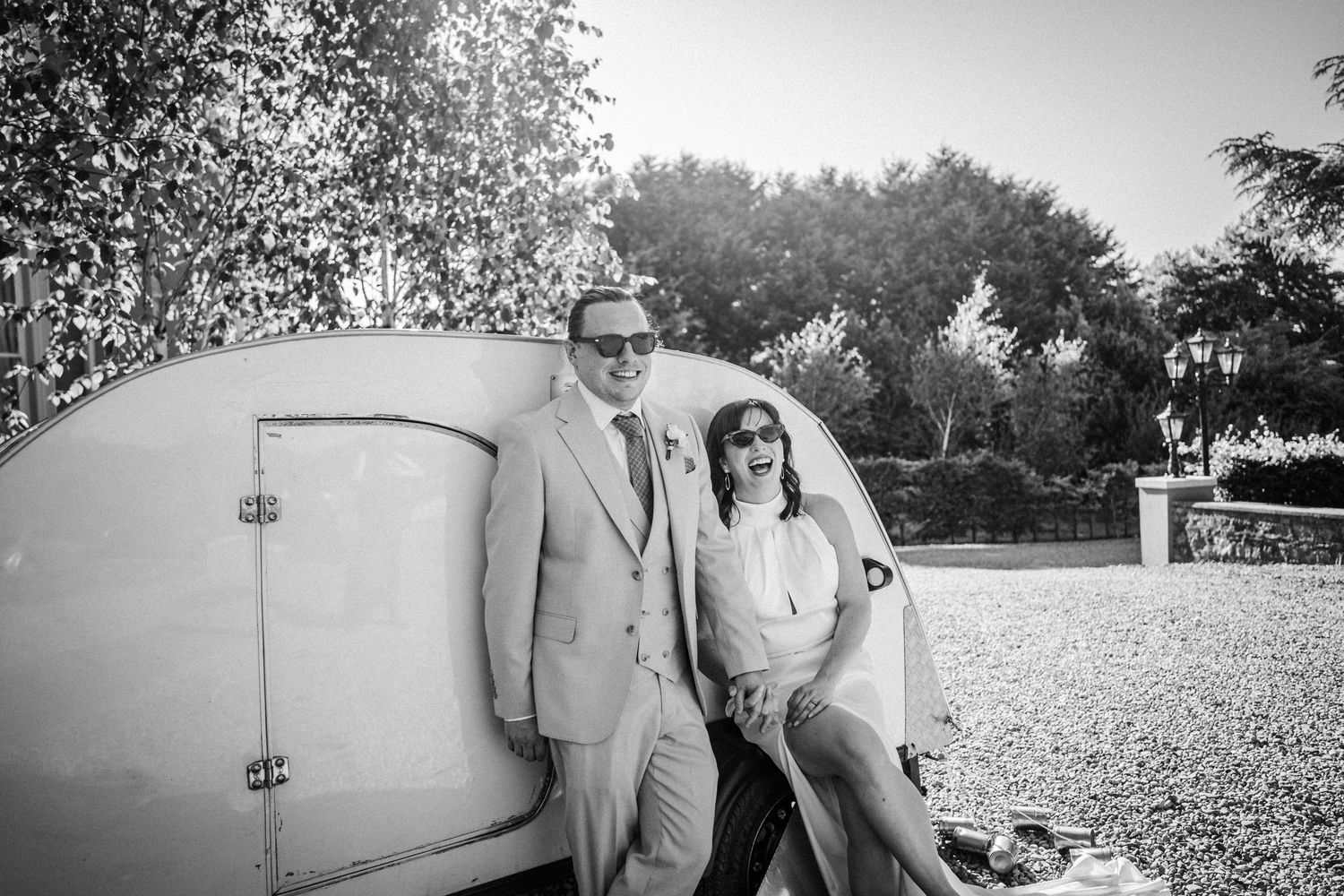 Black and white wedding photo collage showing various outdoor moments and poses with surfboards.