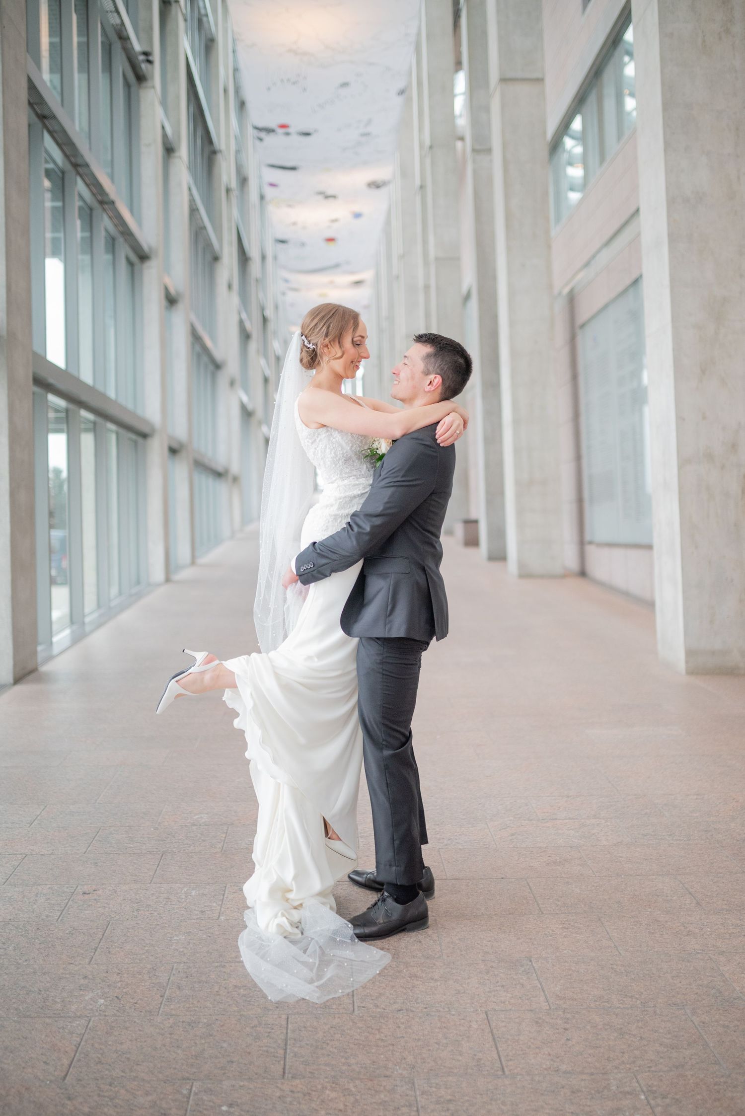 Bride and groom portraits and exchange private vows inside the National Gallery of Canada