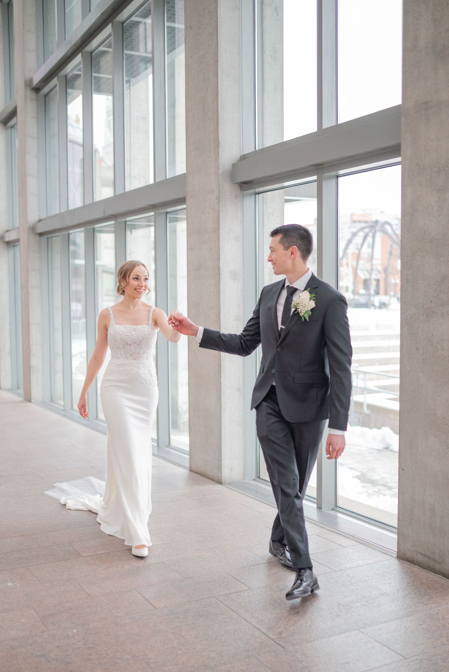 Bride and groom portraits and exchange private vows inside the National Gallery of Canada