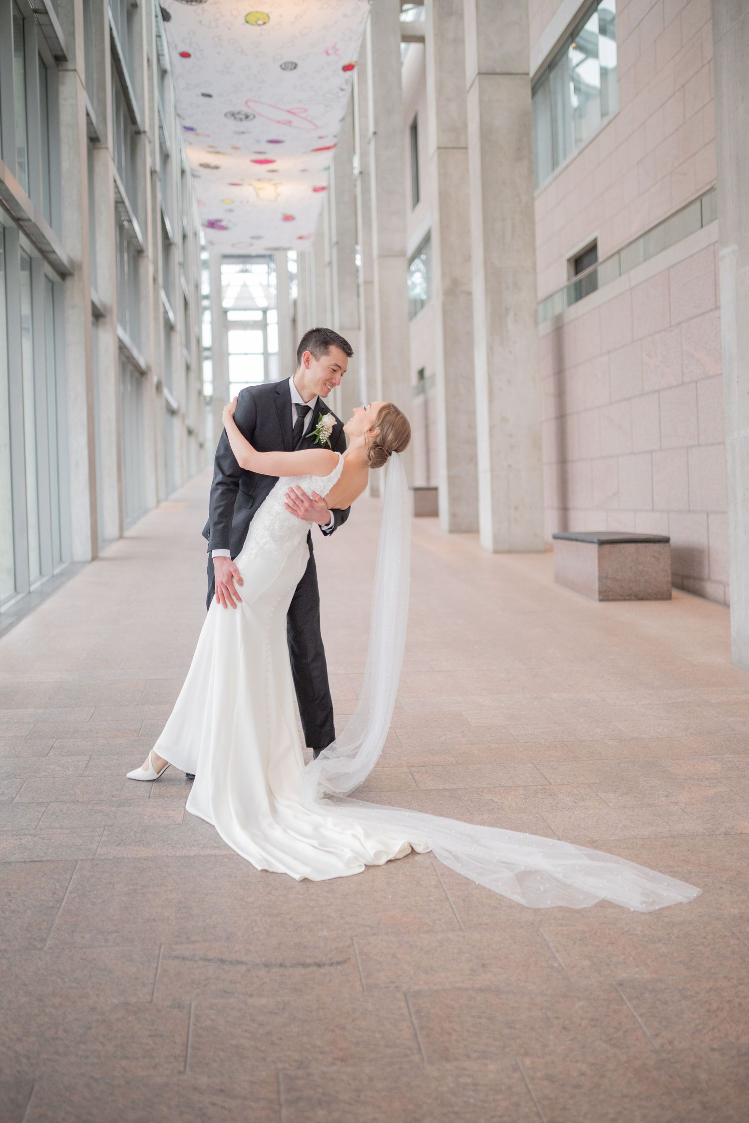 Bride and groom portraits and exchange private vows inside the National Gallery of Canada
