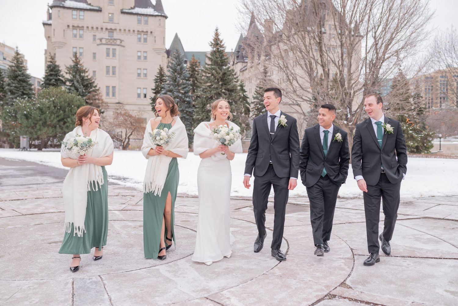 Wedding party in snowy Major’s Hill Park with Ottawa skyline in background