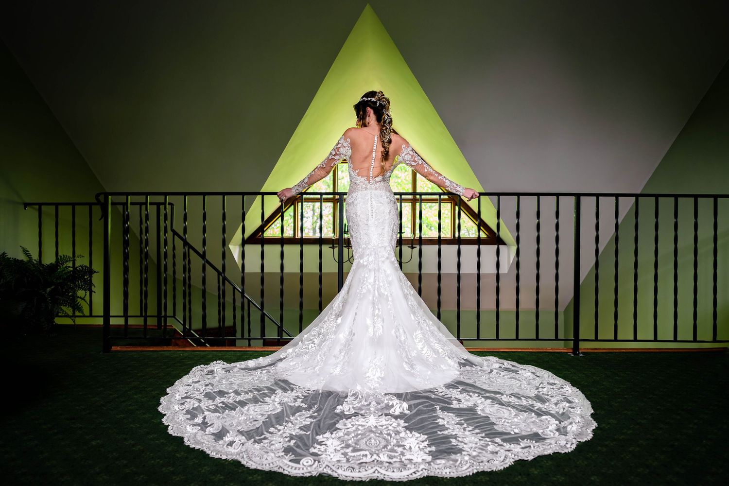 Dramatic bridal portraits showing the full sweep of a lace wedding gown train.