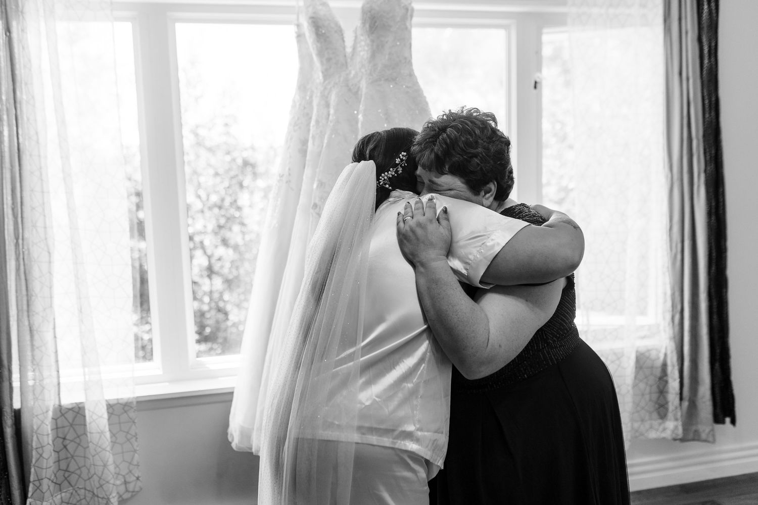 Black and white photo sequence showing embrace and tender moment between wedding couple during first look.