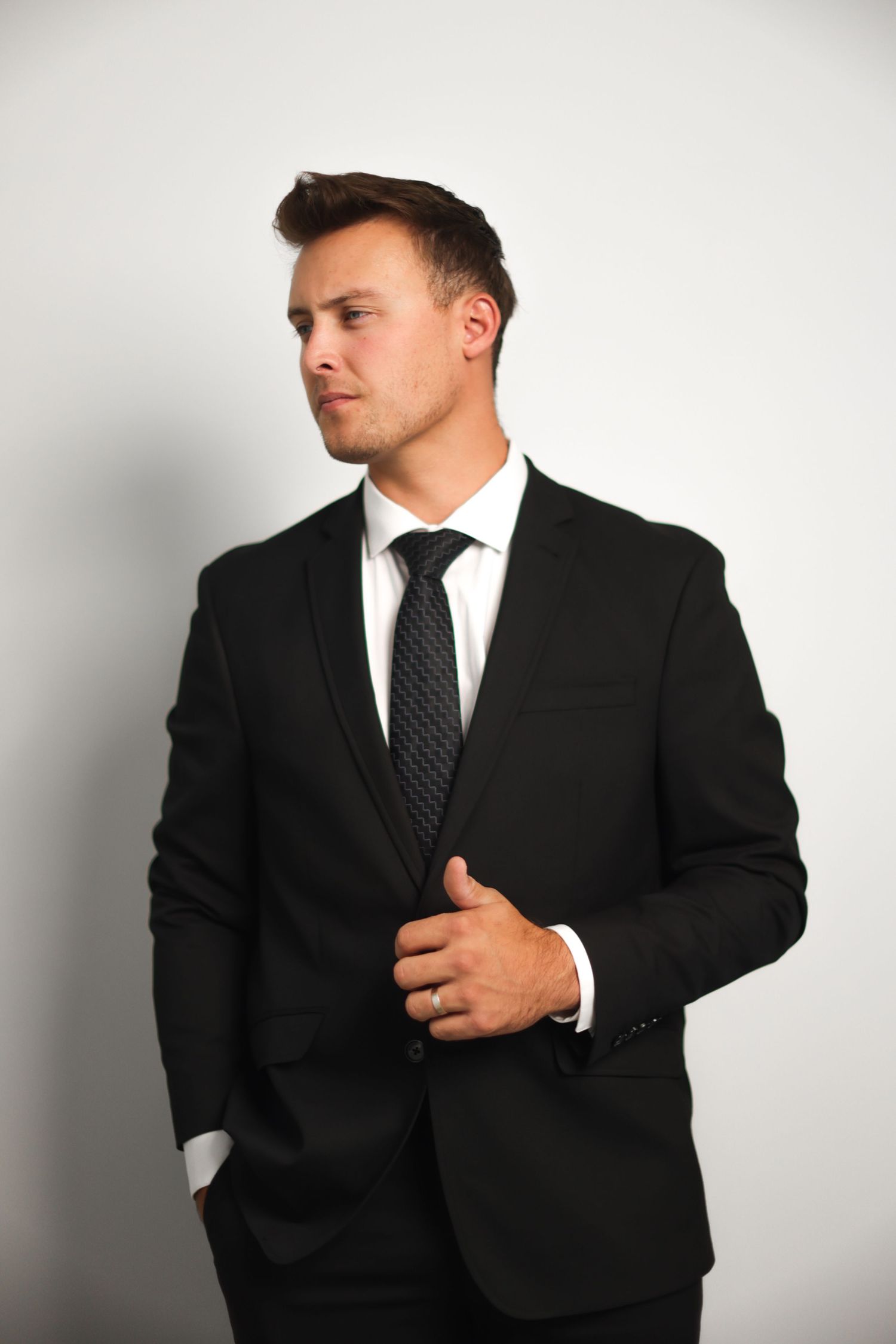Man in business attire shown in multiple dynamic poses against white backdrop.