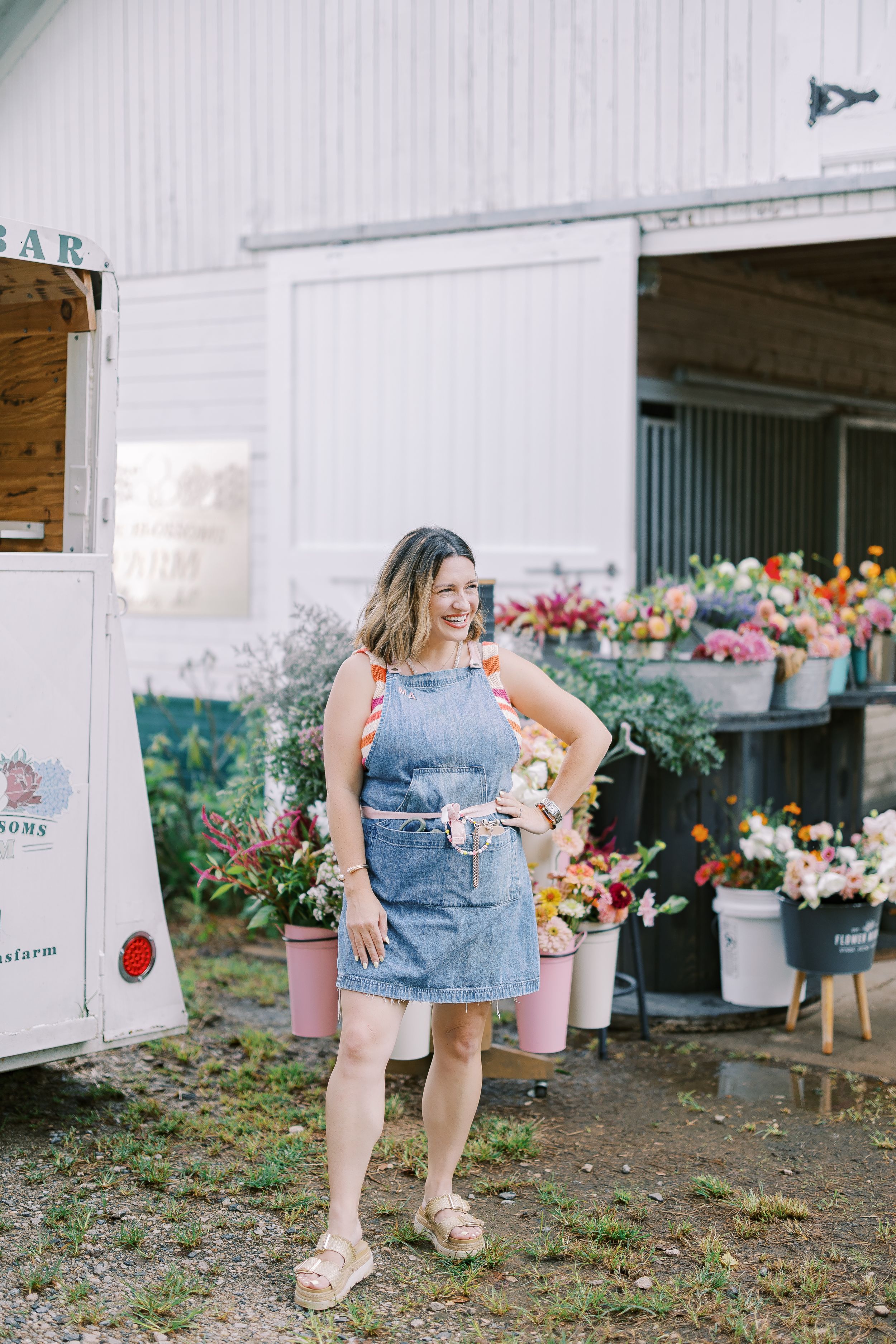 A series of photos showing denim shorts and fresh flowers at a rustic flower stand with white walls.