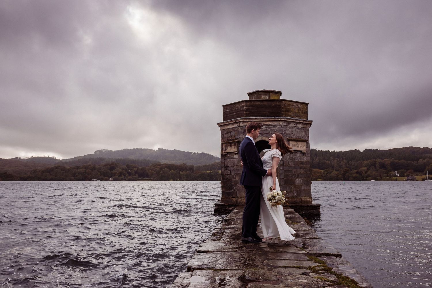 Autumn wedding couple with moody sky