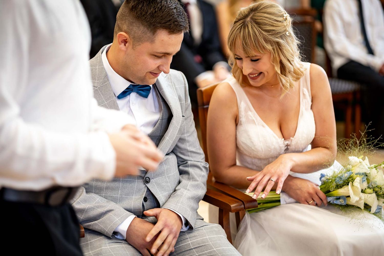 Candid moments of newlyweds laughing together during wedding reception.