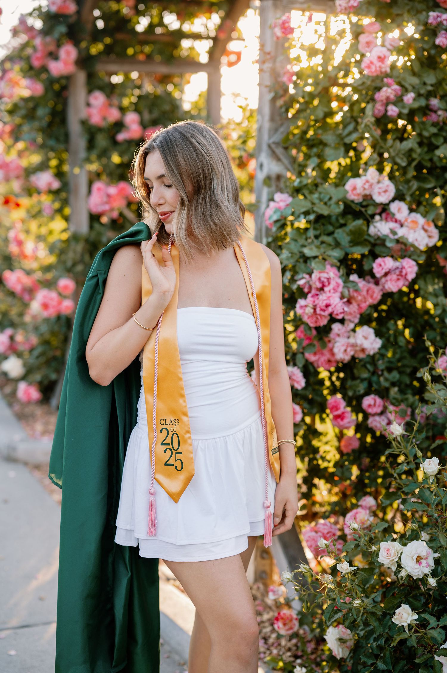 Garden senior pictures in the spring at golden hour