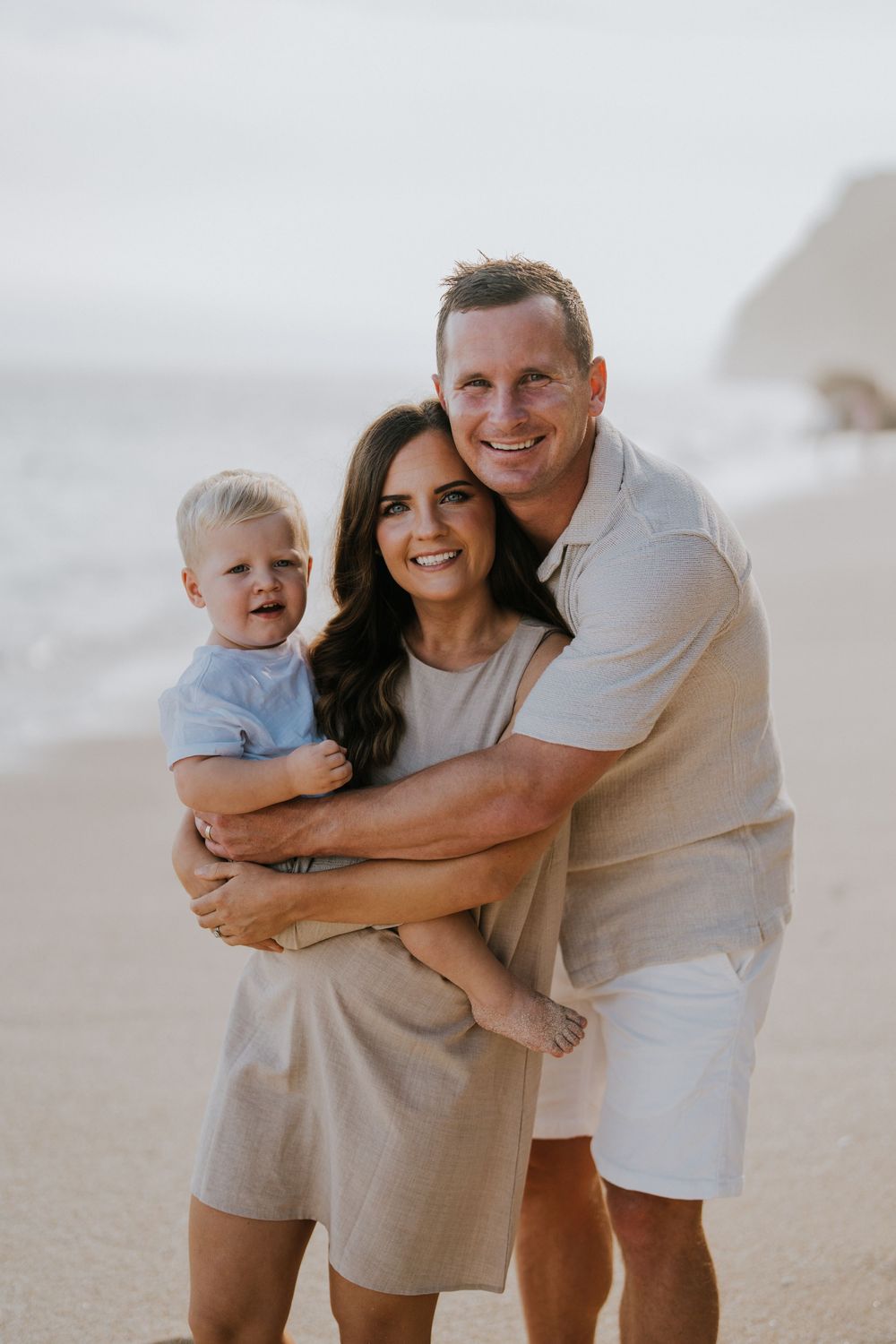 Beach family photography in Bali with an 
ocean backdrop