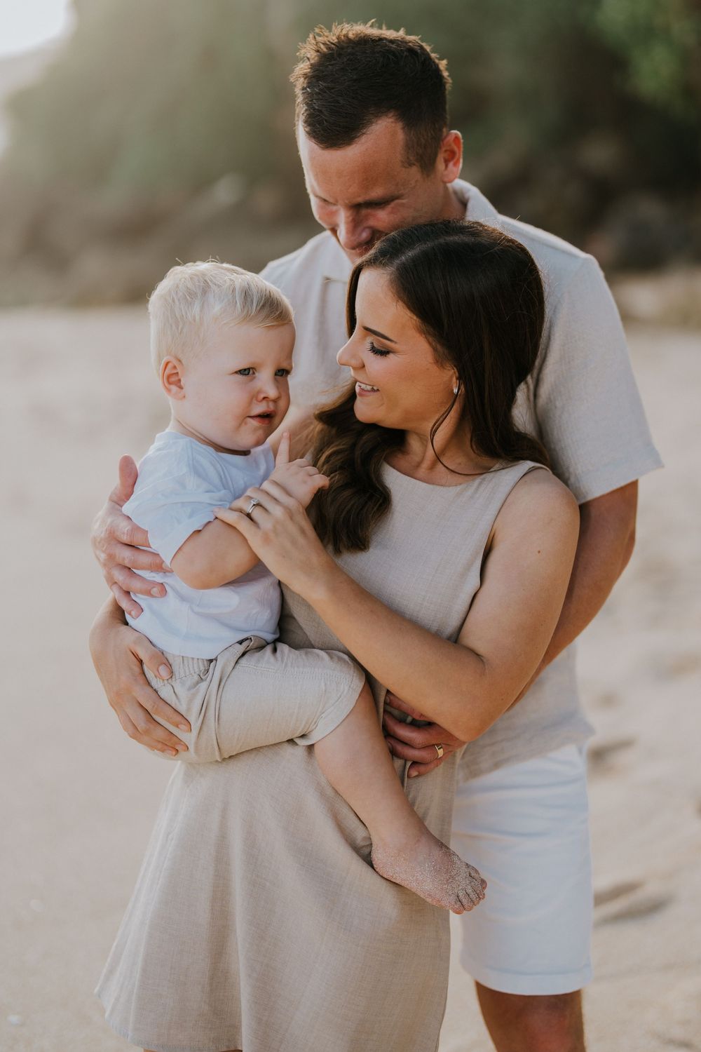 Beach family photography in Bali with an 
ocean backdrop
