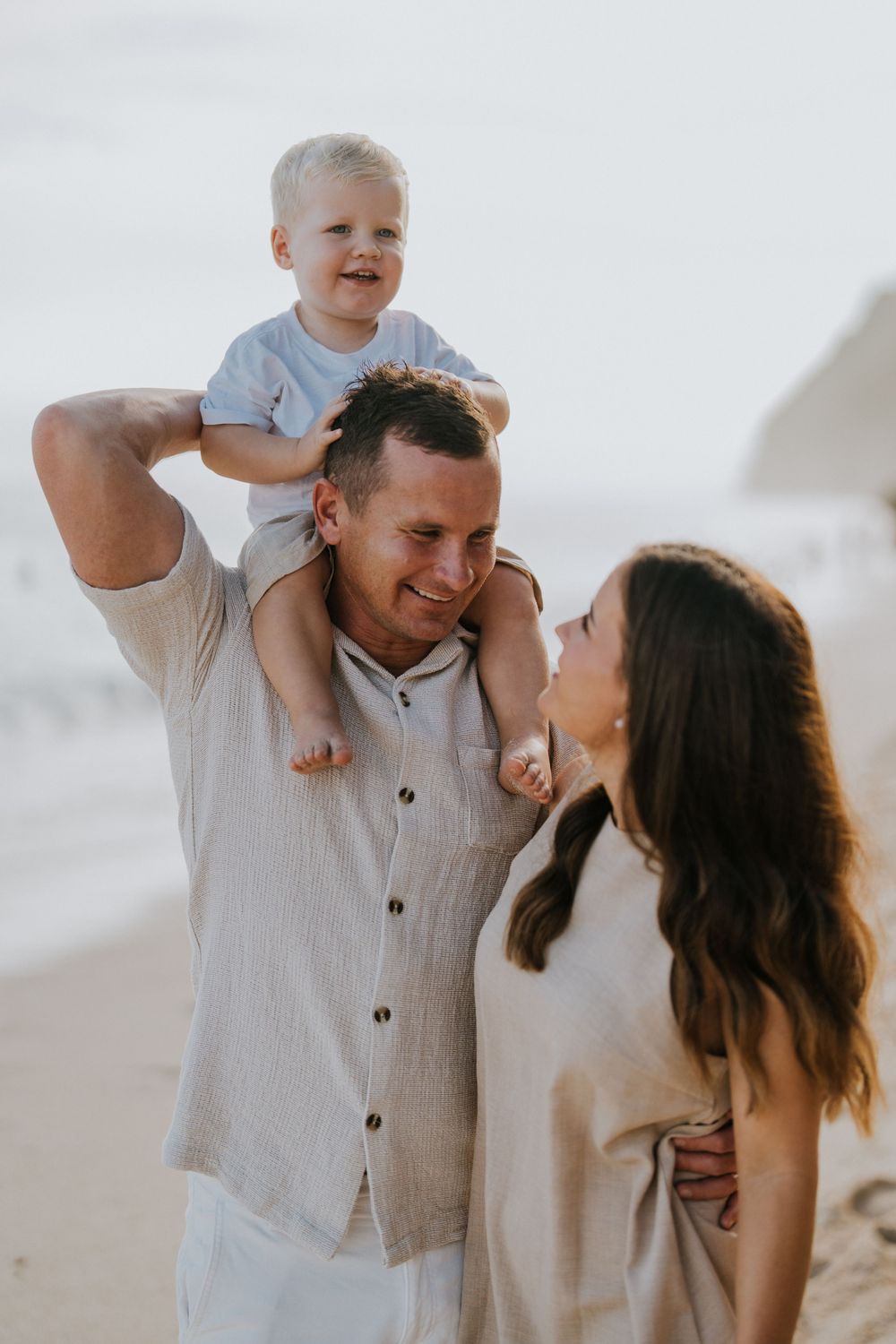 Beach family photography in Bali with an 
ocean backdrop