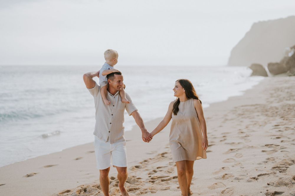 Beach family photography in Bali with an 
ocean backdrop