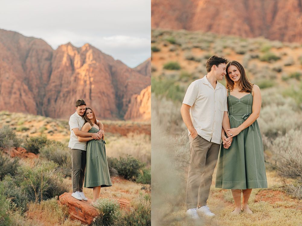 Couple embracing in desert landscape with red rock formations and green sagebrush at golden hour.