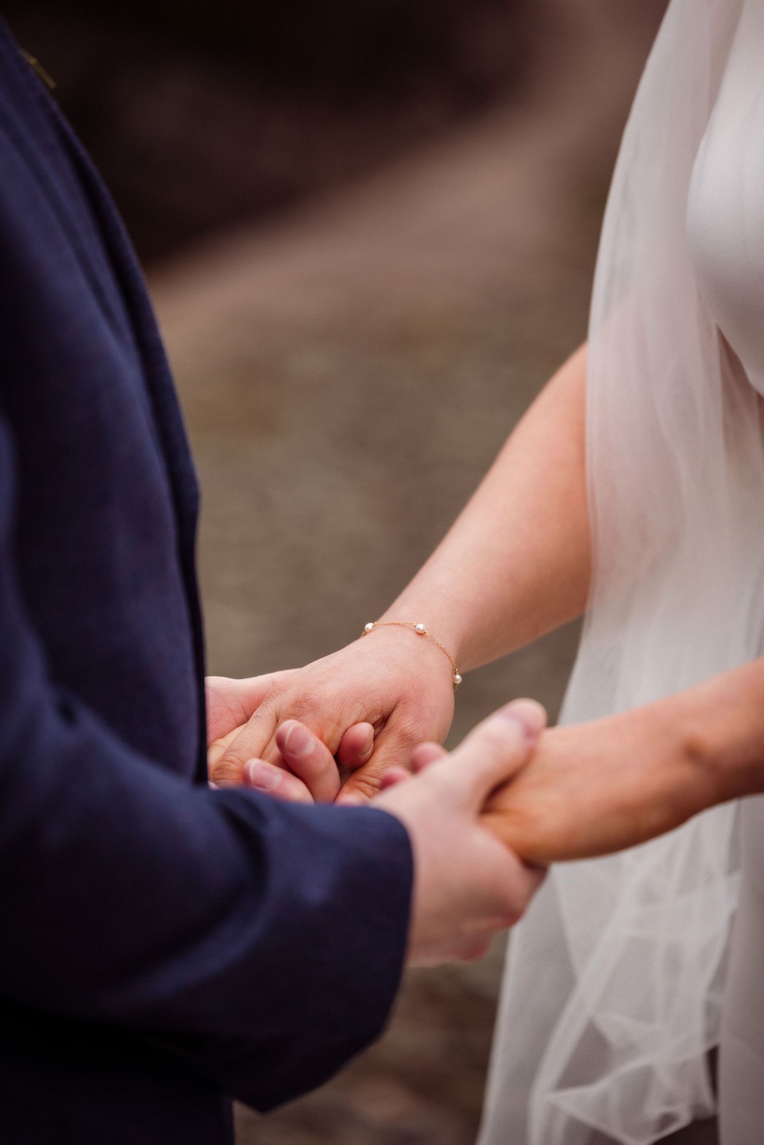 Close up of hands during the ceremony at Storrs Hall