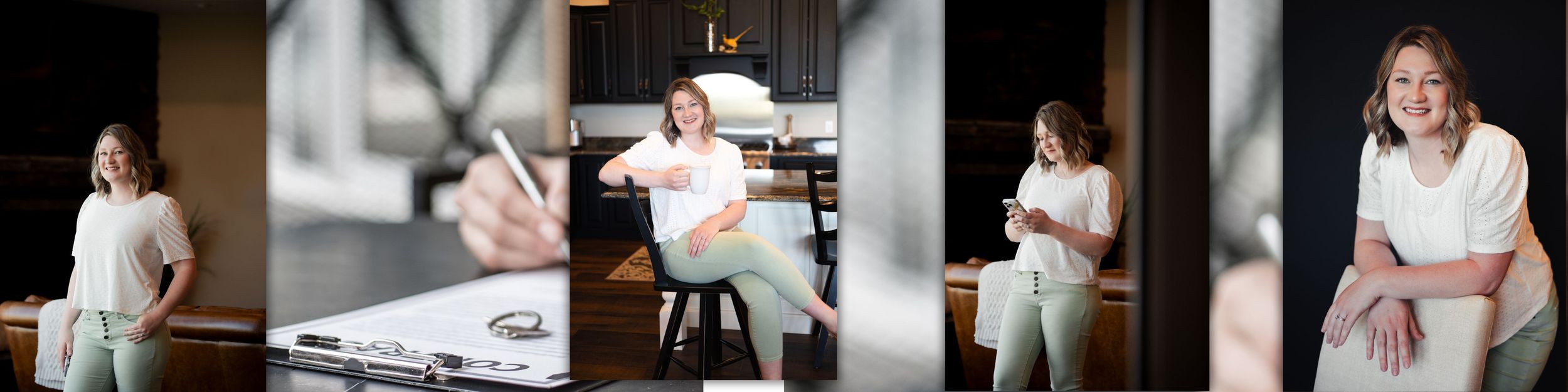 Photographer in white attire reviewing photos on laptop while sitting at wooden desk in natural lighting.
