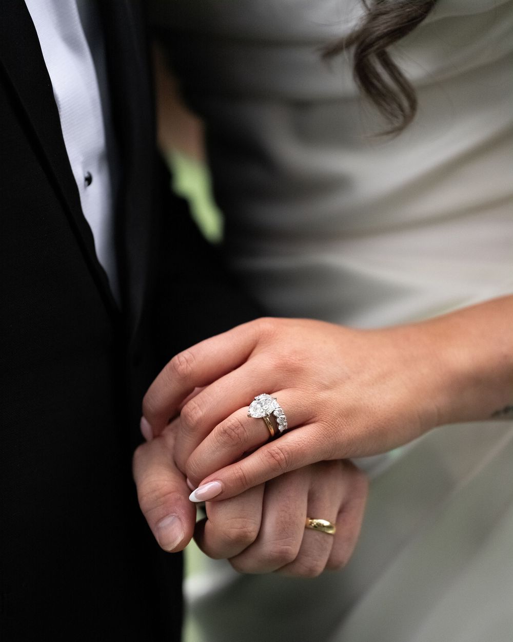 Close-up sequence showing sparkly diamond engagement ring on a hand.