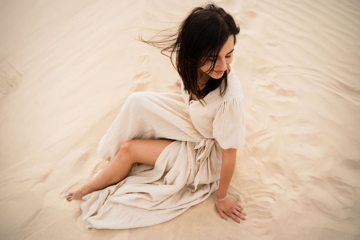 beach photoshoot in abu dhabi clinet closet options cream dress